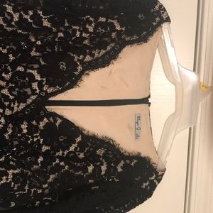 A midi black dress with lace or net.